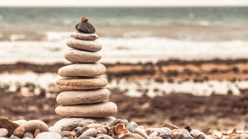 Tower of balanced stones on beach