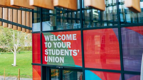 Welcome sign on exterior of Students' Union building 