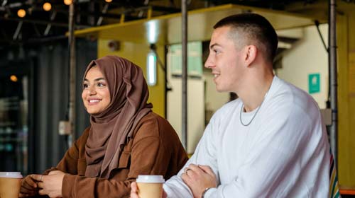 Two students talking over a coffee in York