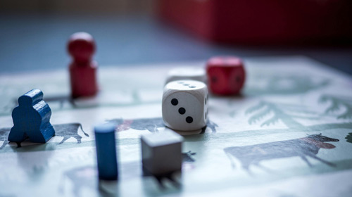 An image of a board game with a dice