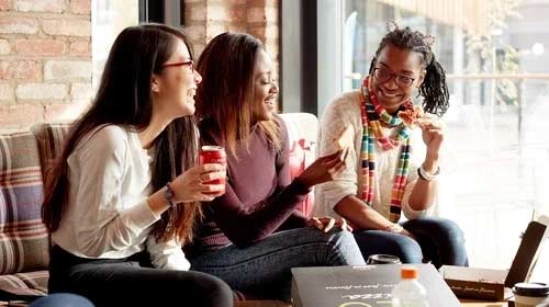 Three students in the campus dining hall.