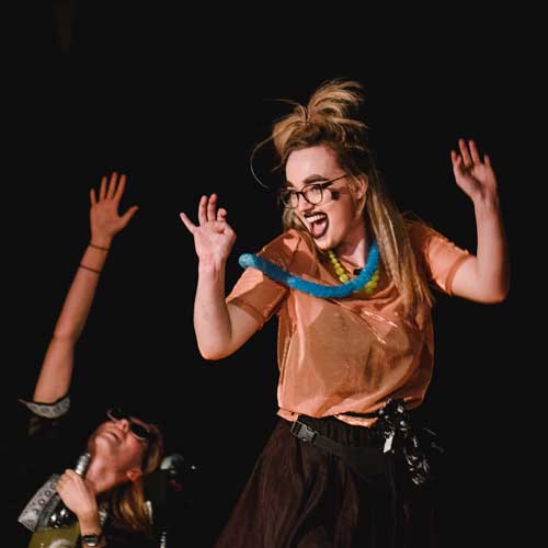 Drama performance, students wearing face paints