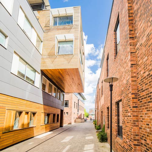 The De Grey building on campus, on a sunny day.