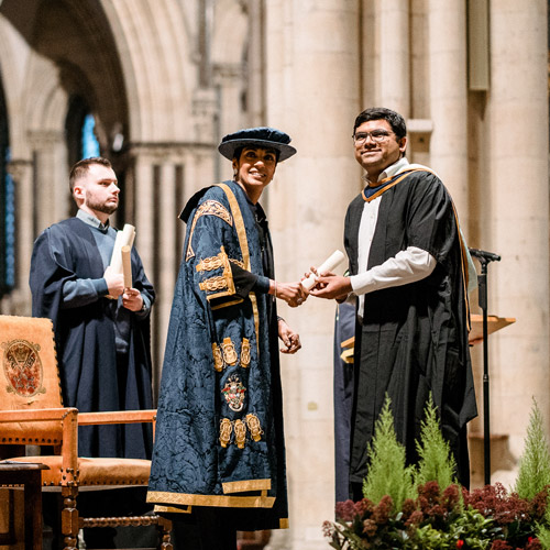 Student shaking hands with Vice-Chancellor during degree ceremony