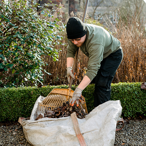 grounds team on campus in nature