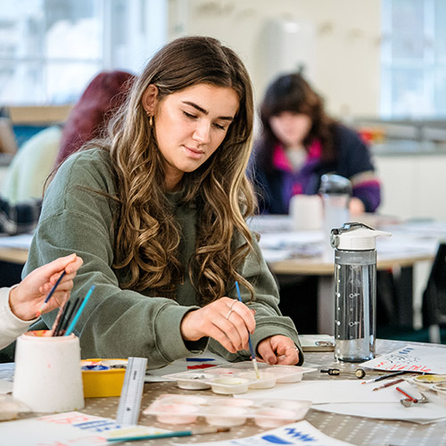 Trainee teacher painting