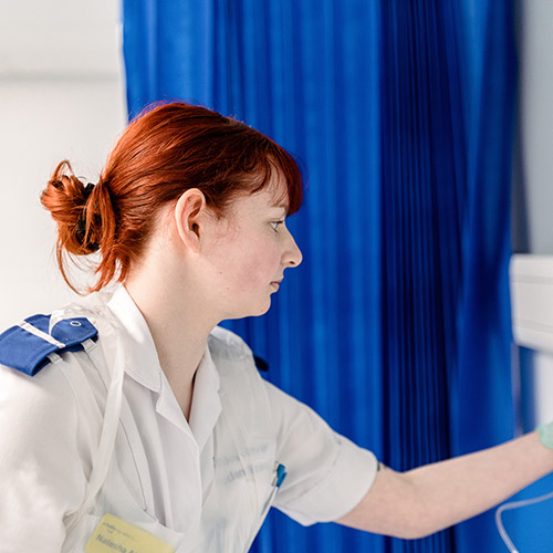 Nurse checking stats