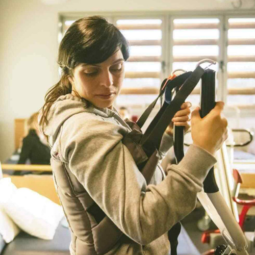 A student uses occupational therapy equipment.