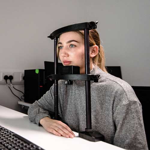 Student using psychology laboratory equipment