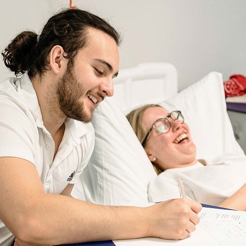 Nursing and physiotherapy students in a practical on the university practice ward.
