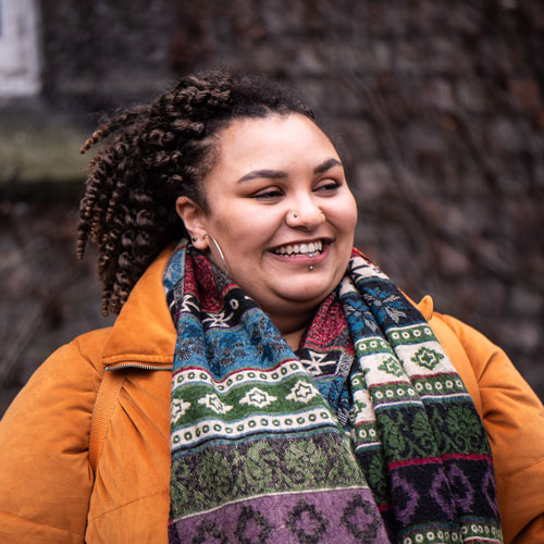 Mature student looking happy on campus