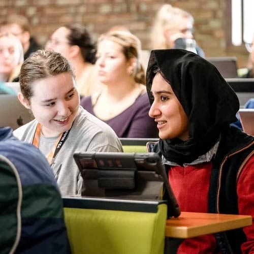 Two students in a lecture.