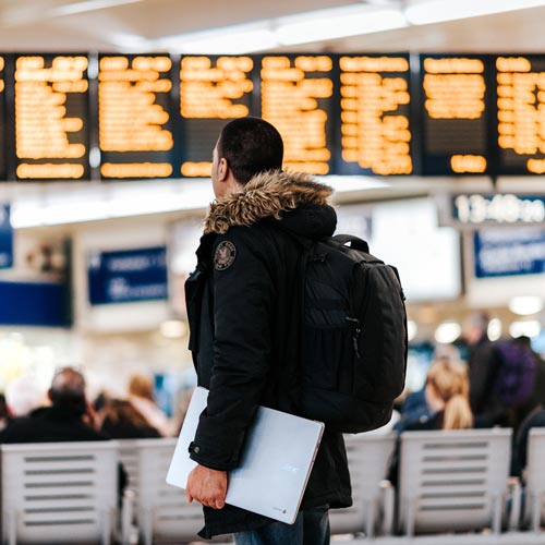 Person with a backpack stood in the airport
