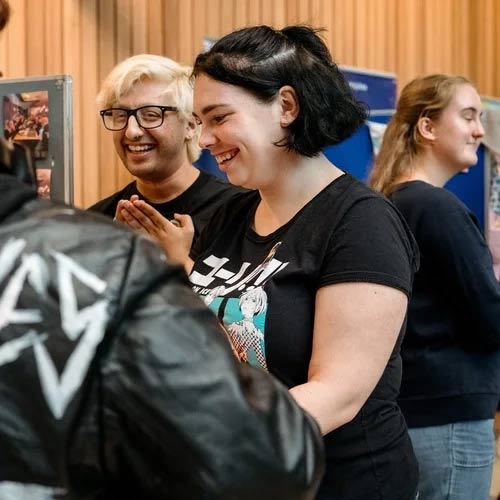 Two students chatting at a Welcome Week event.