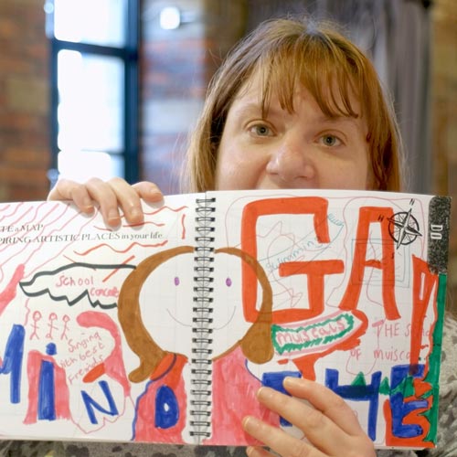 Participant showing picture they have drawn in Creative Doodle Book