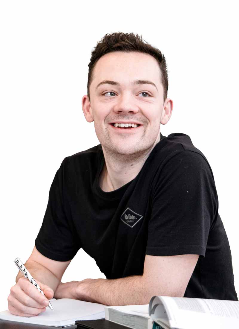 Male student smiling at camera