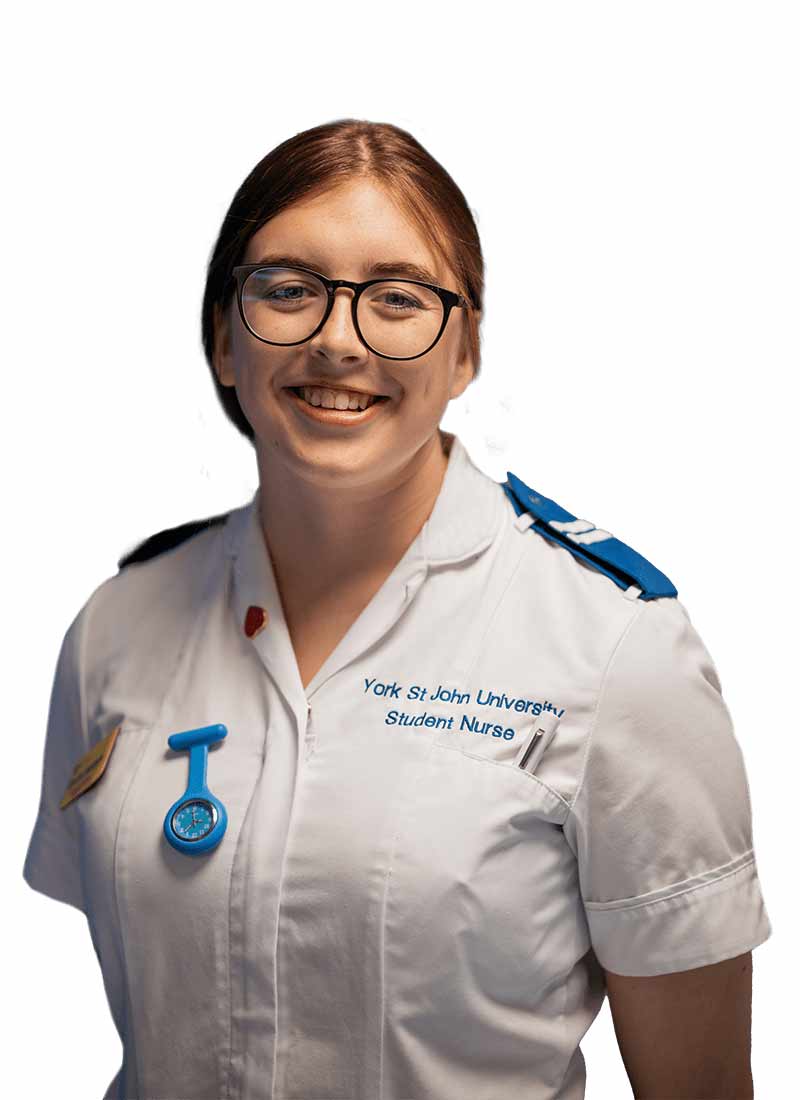 Female nursing student wearing glasses, she is wearing her nurses uniform and smiling at the camera.