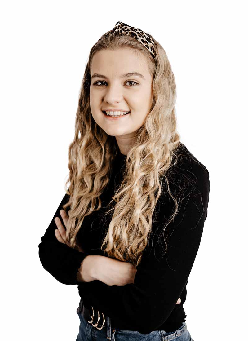 Blonde female student smiling at the camera