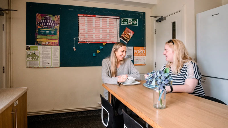 Two students in the kitchen of Garden Street accommodation.