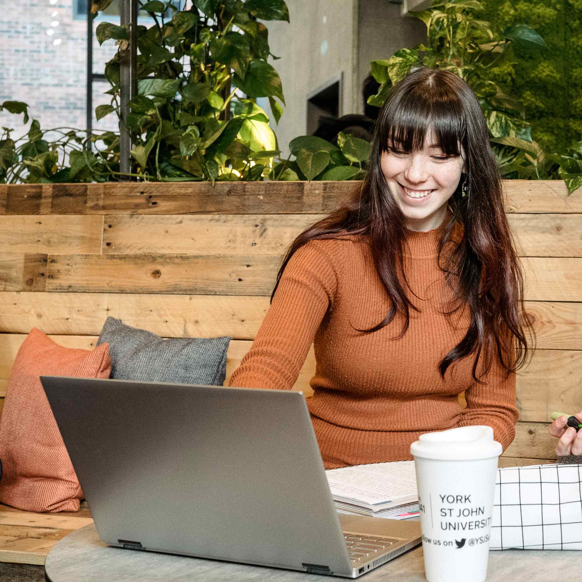 A student using a laptop.