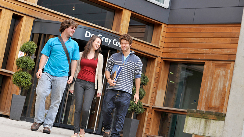 Students walking through De Grey court