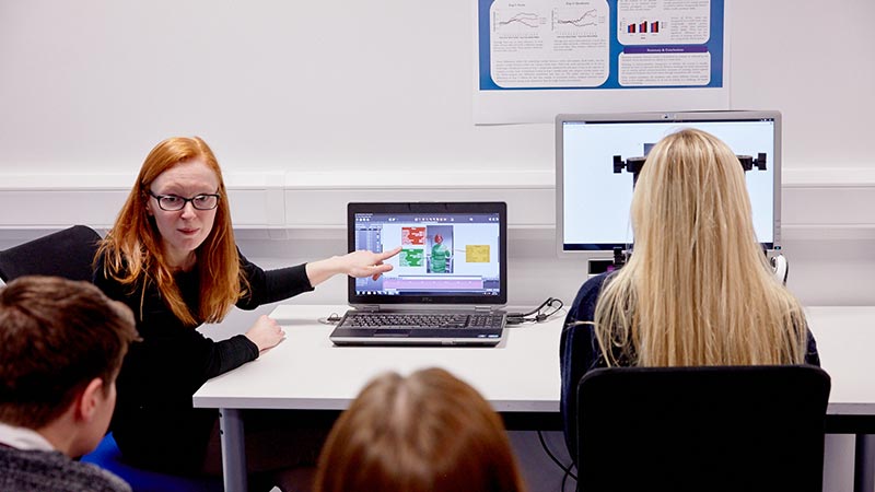 Staff demonstrating equipment to students