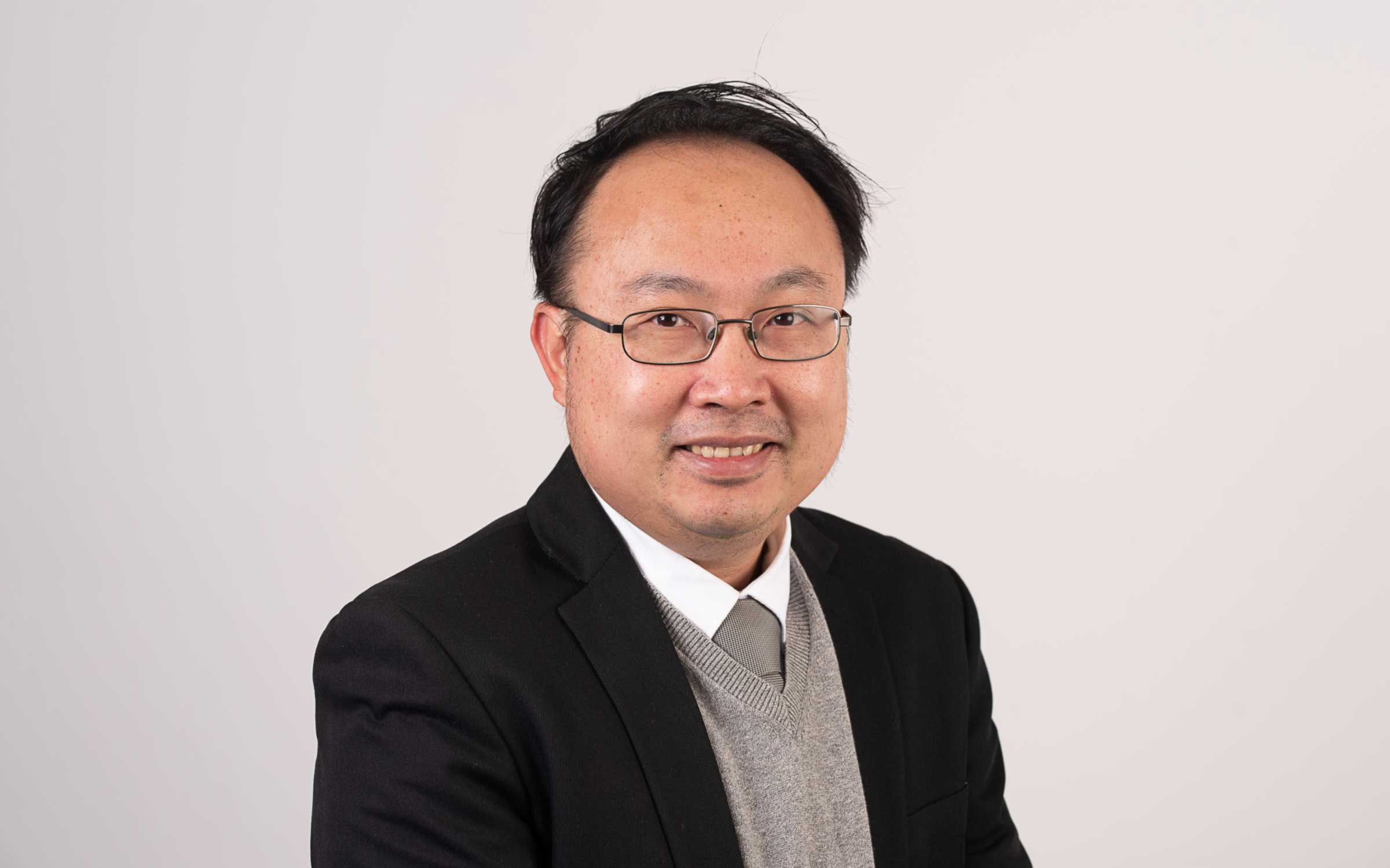 A staff profile image of Alex Lo