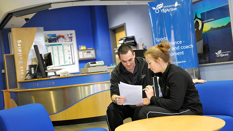 Two people in Foss Reception